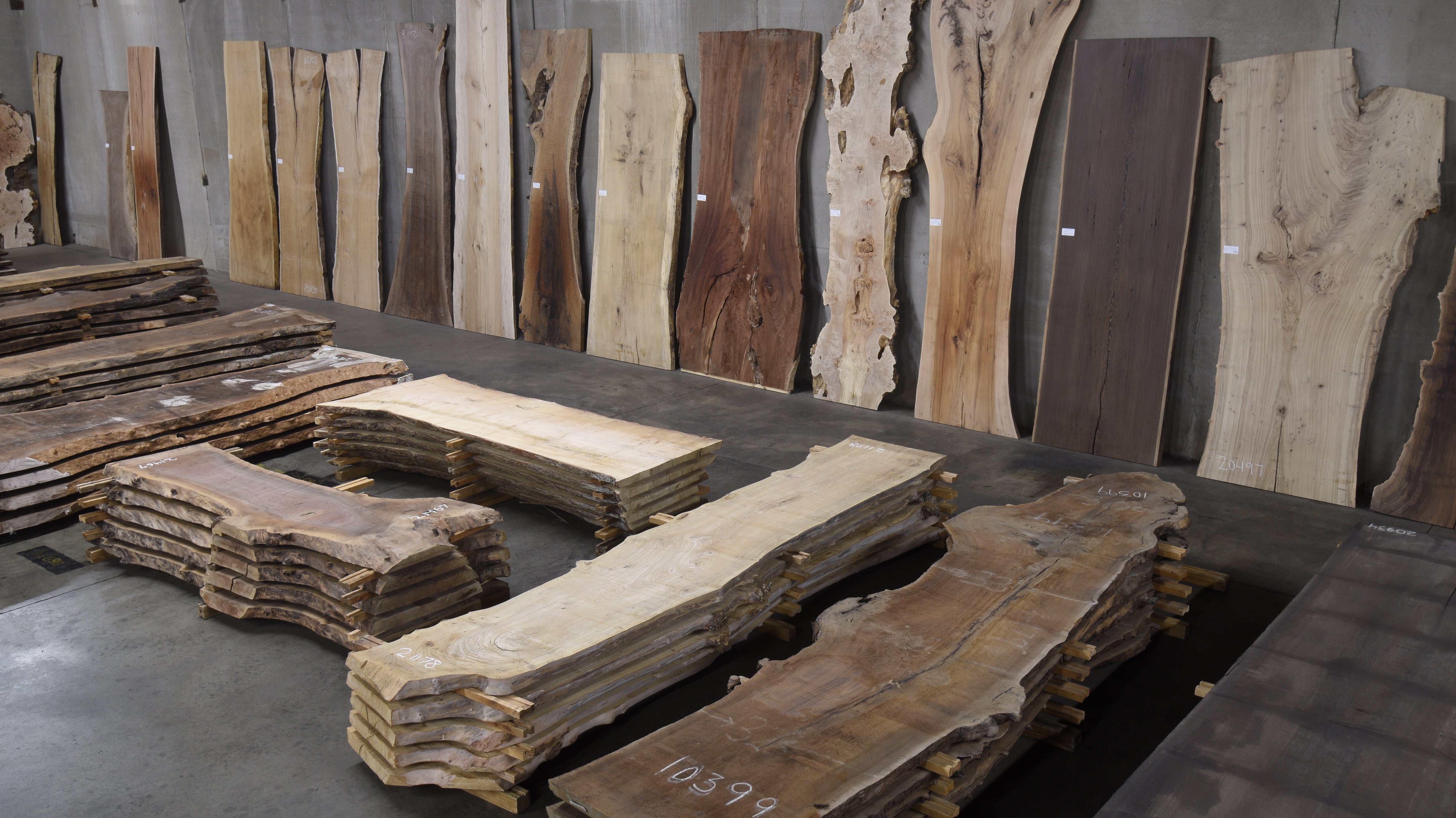 Choosing wood slabs at CS Woods warehouse Denver