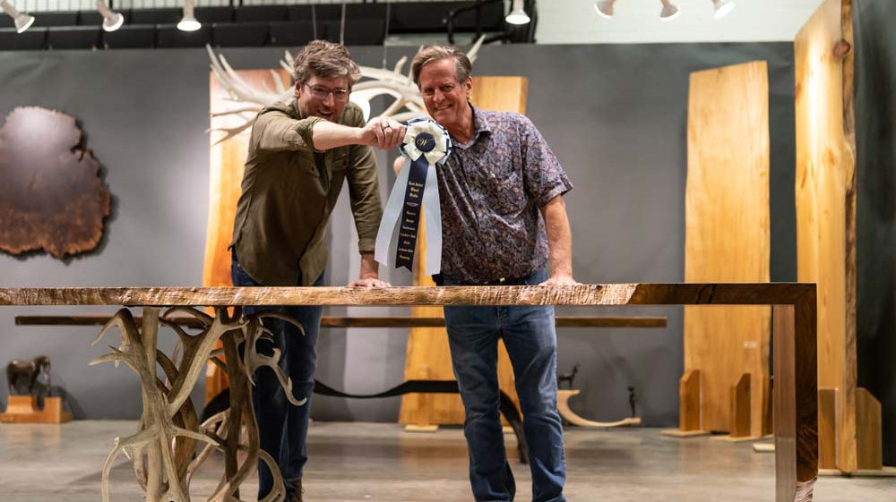 Kent Mace and Shawn Rivett celebrate their blue ribbon win for Best Collaboration at the Western Design Conference in Jackson Hole, Wyoming