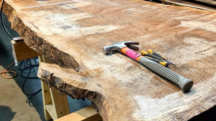 Walnut Slab with a circular saw and other tools ready to be used!