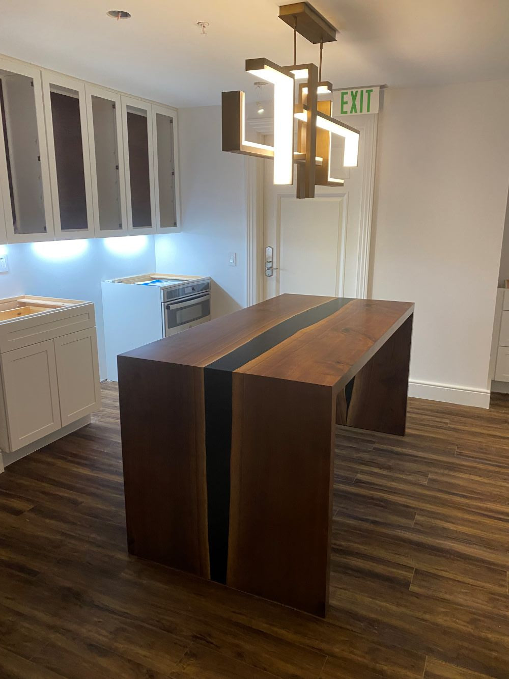 Live edge waterfall river walnut bar top with black epoxy.
