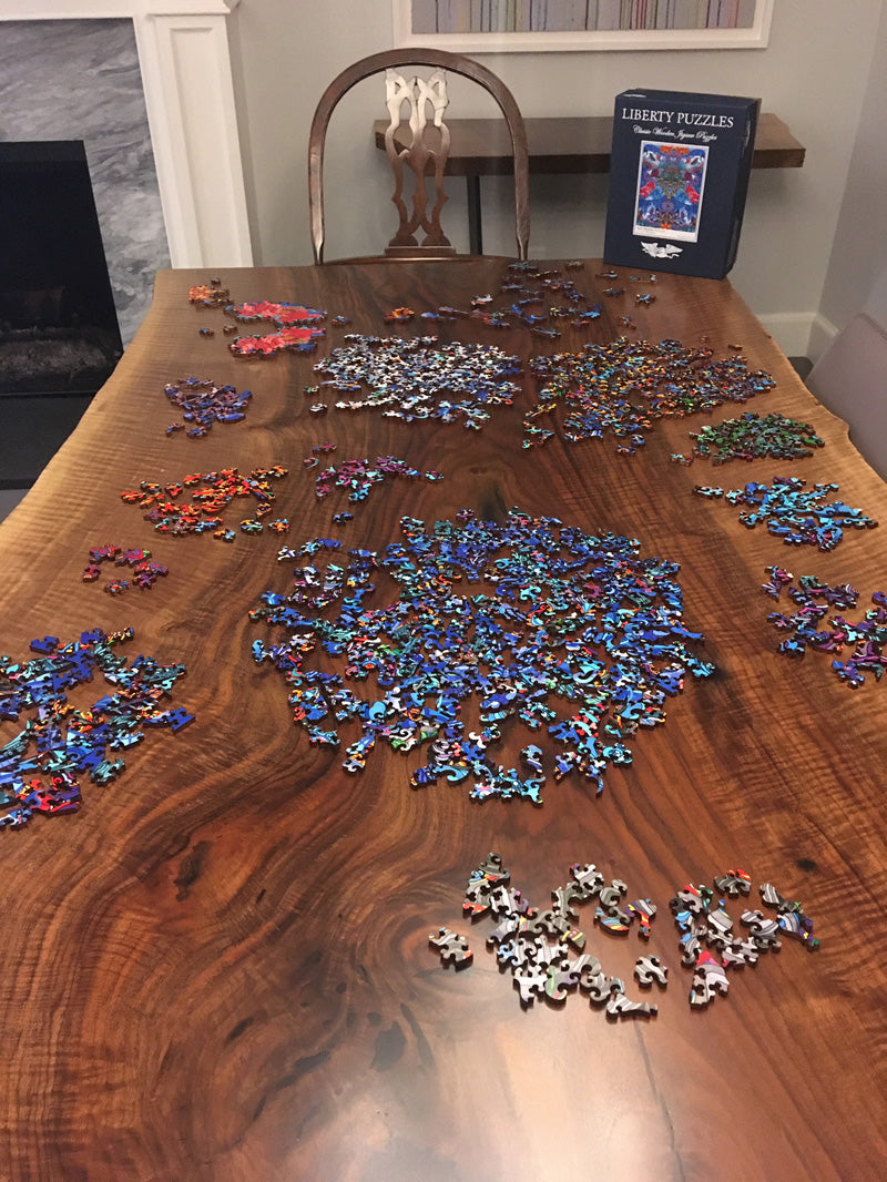 Puzzle pieces on a slab dining table handcrafted by CS Woods.