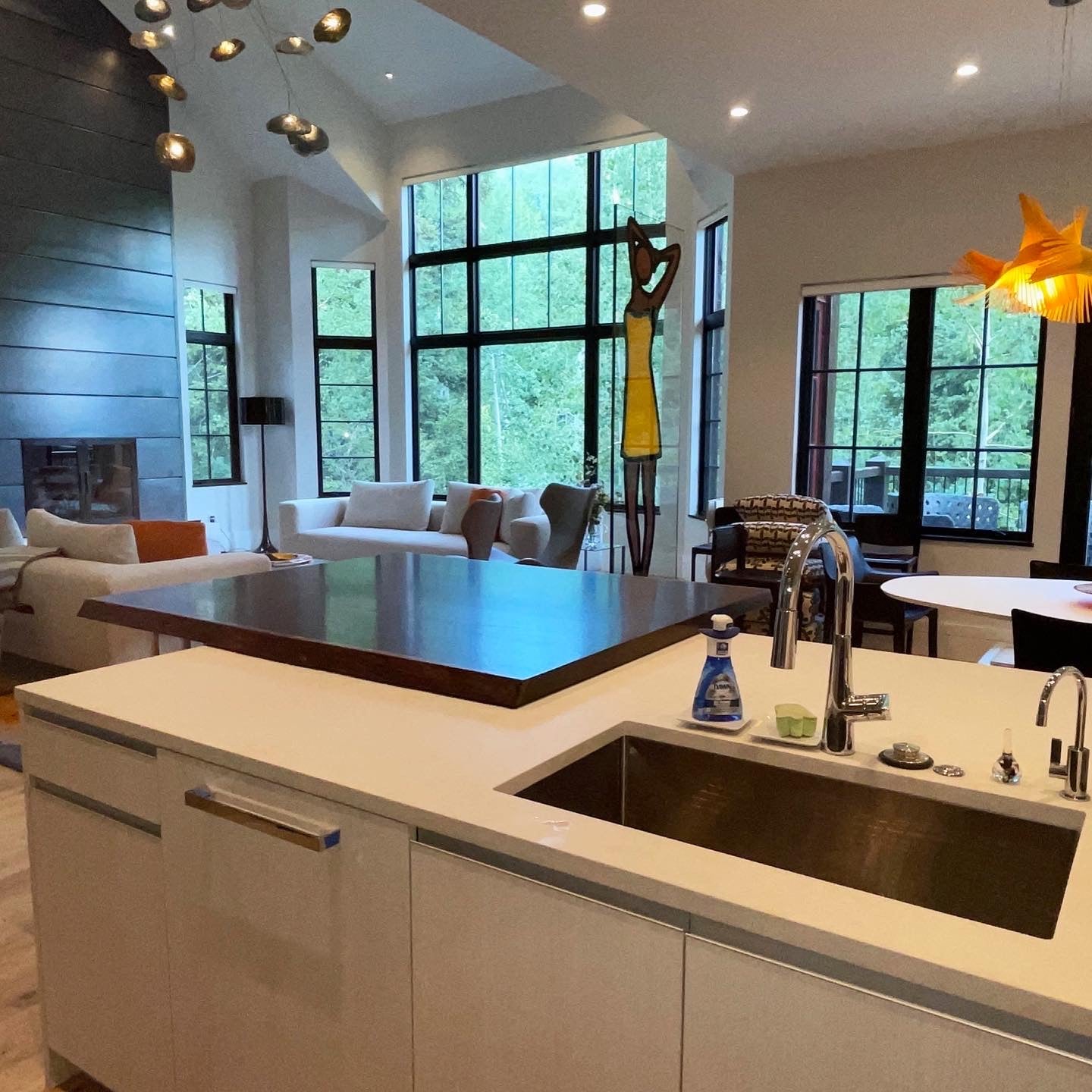 Wenge solid wood slab kitchen island extension in art inspired kitchen space.
