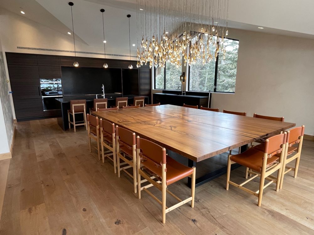 Elm Matched Slab clean edged table with metal cross detail.