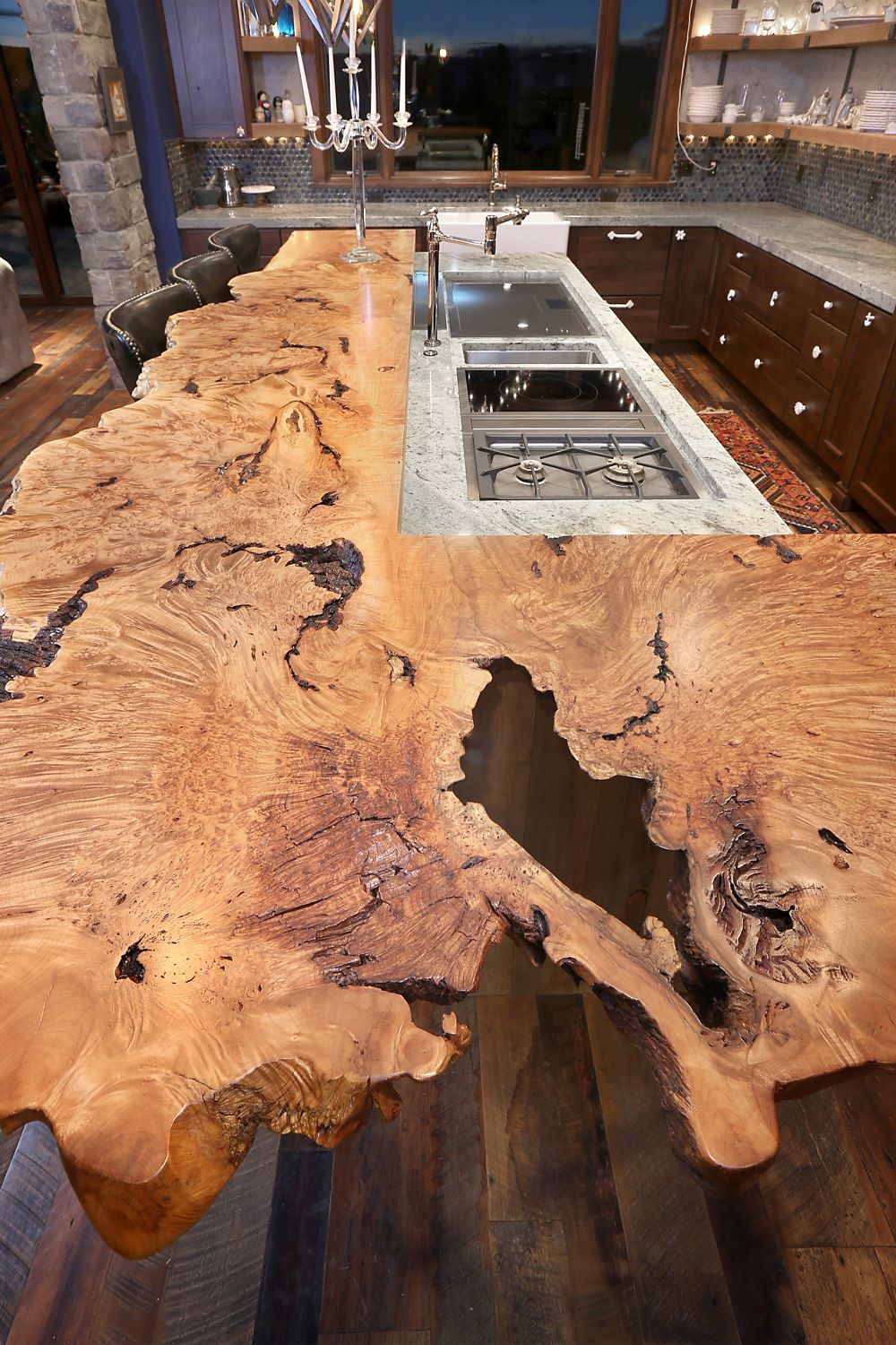 Luxury Maple burl kitchen island with sink cutout. 
